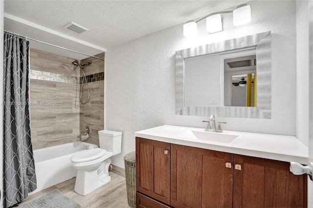 bathroom with a textured ceiling, toilet, shower / tub combo with curtain, visible vents, and a textured wall
