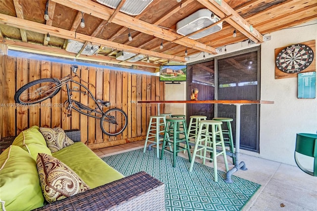 view of patio / terrace with an outdoor hangout area, visible vents, and fence