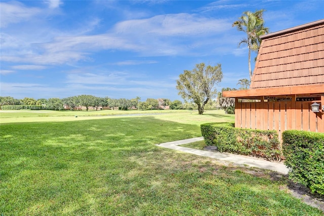 view of yard featuring view of golf course