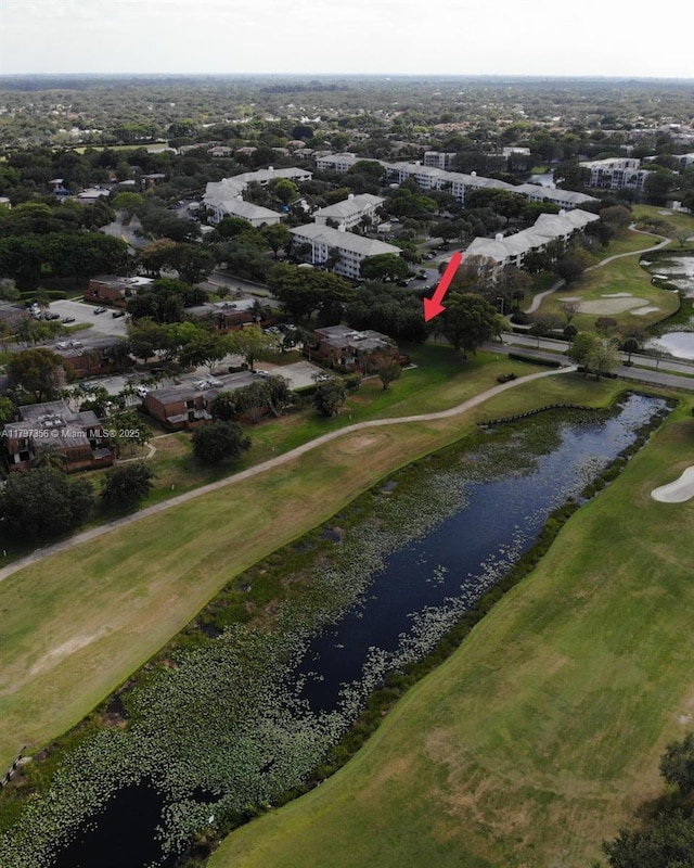 aerial view featuring a water view and golf course view