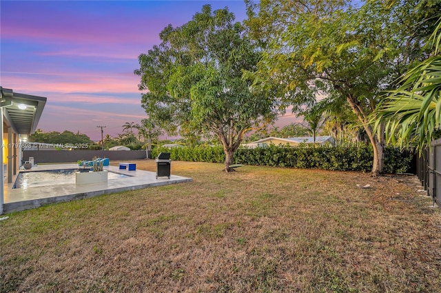 8501 SW 142nd St, Palmetto Bay, FL 33158 - yard at dusk with a patio and a fenced backyard