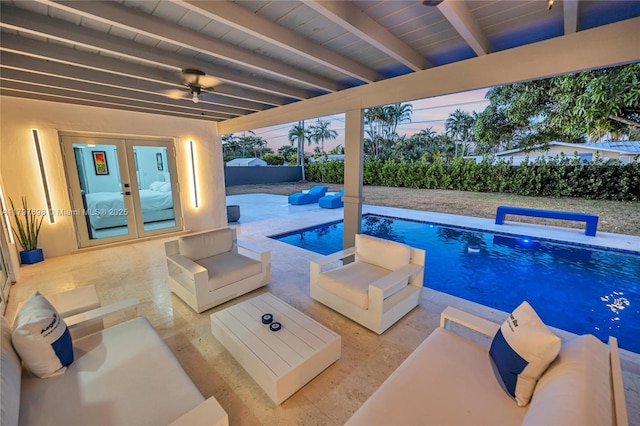 8501 SW 142nd St, Palmetto Bay, FL 33158 - pool at dusk featuring an outdoor hangout area, a patio, a ceiling fan, and a fenced in pool