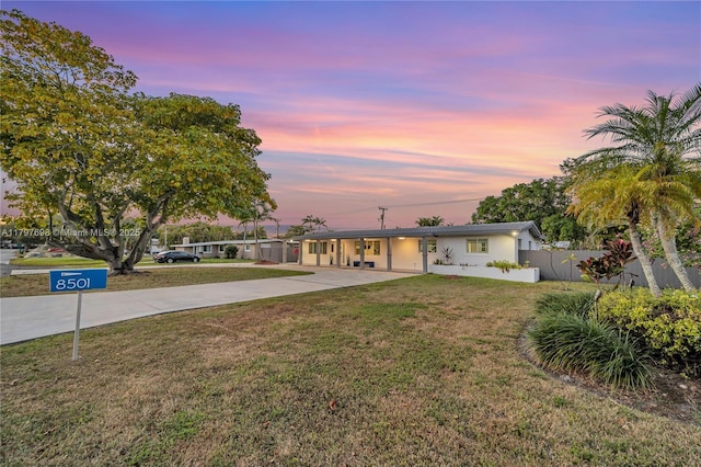 8501 SW 142nd St, Palmetto Bay, FL 33158 - view of front of house featuring concrete driveway, fence, and a front yard