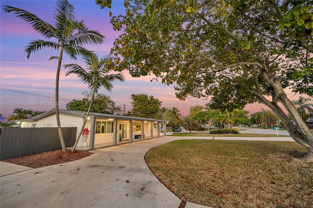 8501 SW 142nd St, Palmetto Bay, FL 33158 - view of front of home with fence, stucco siding, and driveway