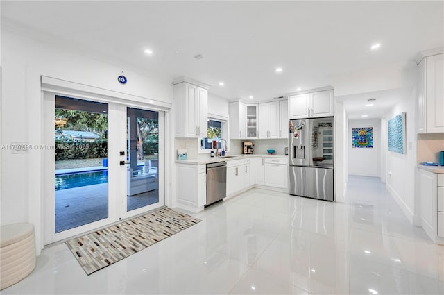 8501 SW 142nd St, Palmetto Bay, FL 33158 - kitchen featuring french doors, a sink, stainless steel dishwasher, light countertops, and light tile patterned flooring