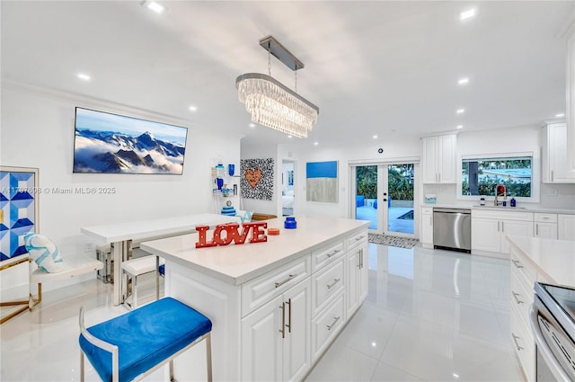 8501 SW 142nd St, Palmetto Bay, FL 33158 - kitchen with a toaster, a sink, a kitchen bar, light countertops, and appliances with stainless steel finishes