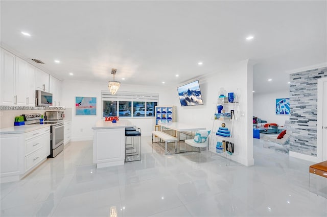 8501 SW 142nd St, Palmetto Bay, FL 33158 - kitchen featuring a sink, stainless steel appliances, white cabinetry, visible vents, and recessed lighting