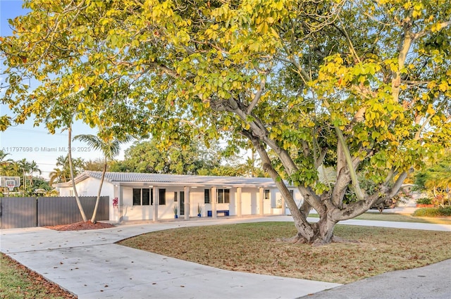 8501 SW 142nd St, Palmetto Bay, FL 33158 - ranch-style house with a tile roof, concrete driveway, and stucco siding