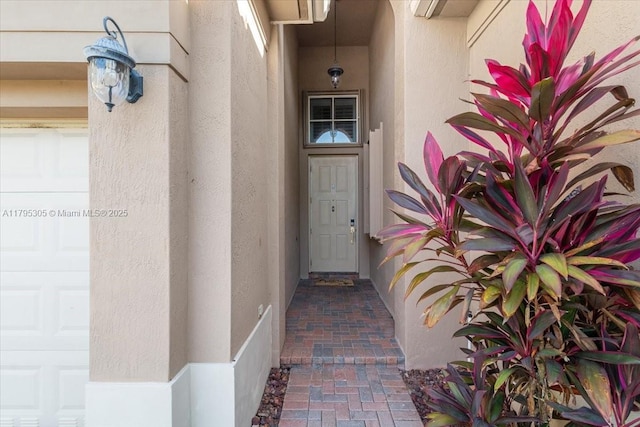12471 NW 78th Mnr, Parkland, FL 33076 - view of exterior entry featuring stucco siding