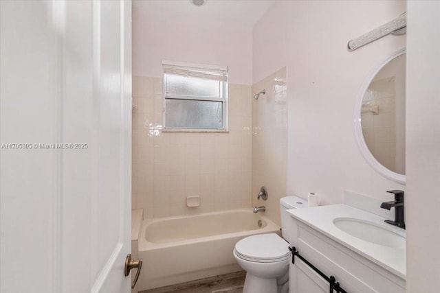 12471 NW 78th Mnr, Parkland, FL 33076 - bathroom featuring toilet, bathtub / shower combination, vanity, and wood finished floors