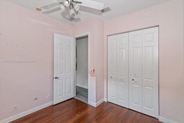 12471 NW 78th Mnr, Parkland, FL 33076 - unfurnished bedroom with dark wood-type flooring, baseboards, a closet, and ceiling fan