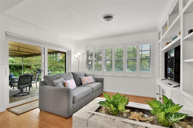 3921 Roosevelt St, Hollywood, FL 33021 - living room with light wood-style floors and baseboards