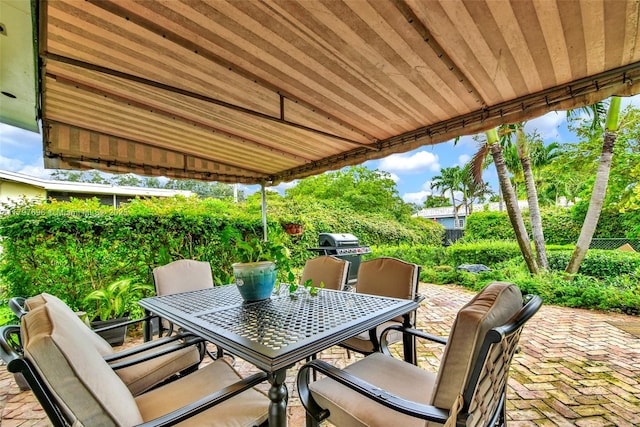 3921 Roosevelt St, Hollywood, FL 33021 - view of patio with outdoor dining space, a fenced backyard, and area for grilling