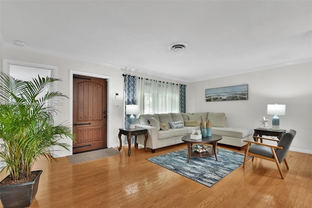 3921 Roosevelt St, Hollywood, FL 33021 - living area featuring ornamental molding, wood finished floors, and baseboards