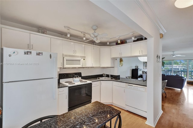 455 Paradise Isle Blvd Unit 209, Hallandale Beach, FL 33009 - kitchen featuring a ceiling fan, white appliances, light wood finished floors, and a sink