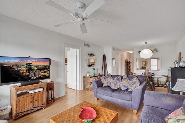 455 Paradise Isle Blvd Unit 209, Hallandale Beach, FL 33009 - living room with light wood finished floors, a textured ceiling, visible vents, ceiling fan, and ornamental molding