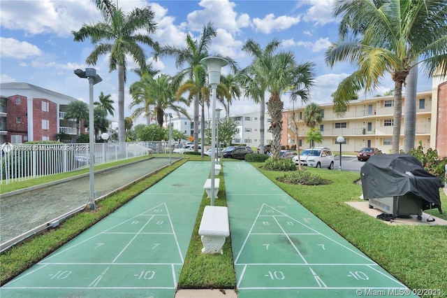 455 Paradise Isle Blvd Unit 209, Hallandale Beach, FL 33009 - view of home's community featuring a yard, shuffleboard, fence, and a residential view