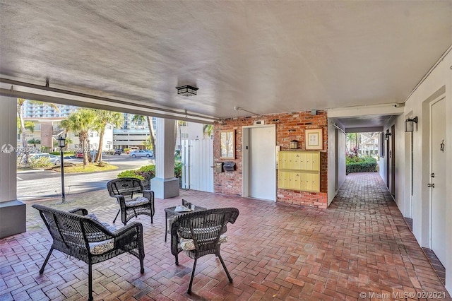 455 Paradise Isle Blvd Unit 209, Hallandale Beach, FL 33009 - view of patio featuring mail area