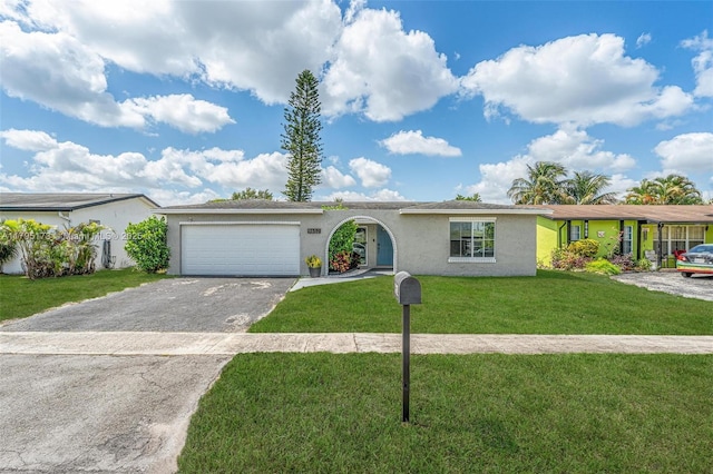 9652 NW 19th Pl, Sunrise, FL 33322 - single story home featuring stucco siding, a garage, driveway, and a front yard