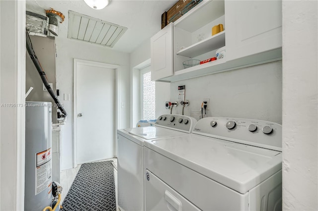 9652 NW 19th Pl, Sunrise, FL 33322 - laundry room featuring cabinet space, washing machine and clothes dryer, and gas water heater
