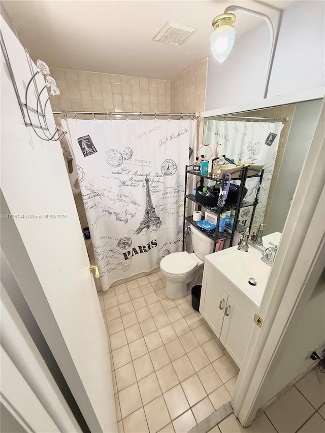 full bathroom with vanity, toilet, a shower with curtain, and tile patterned floors
