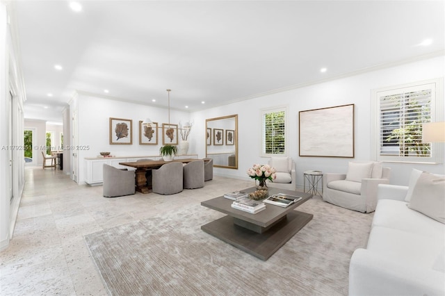 living room with baseboards, ornamental molding, and recessed lighting