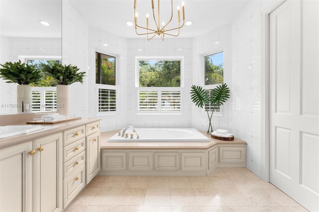 full bathroom featuring tile walls, a garden tub, vanity, and a wealth of natural light