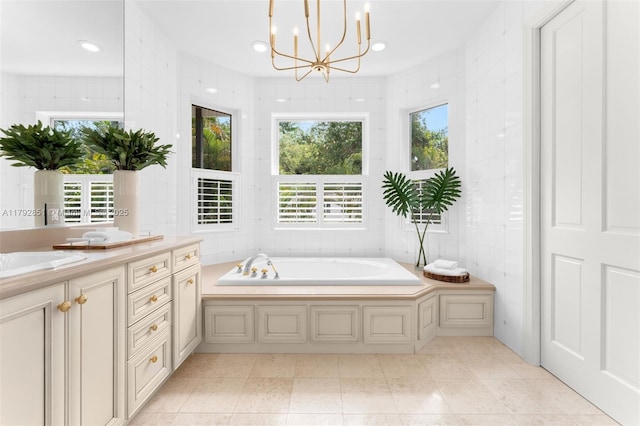 7251 SW 47th Ct, Miami, FL 33143 - full bathroom featuring tile walls, healthy amount of natural light, vanity, a garden tub, and a chandelier