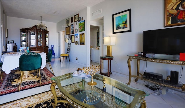 9225 Collins Ave Ph-C, Ph-C Surfside, FL 33154 - living area featuring tile patterned floors, a textured ceiling, and a chandelier