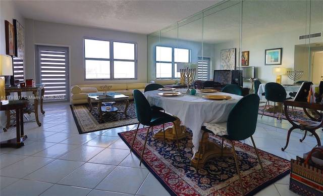 9225 Collins Ave Ph-C, Ph-C Surfside, FL 33154 - dining area with a textured ceiling and light tile patterned floors