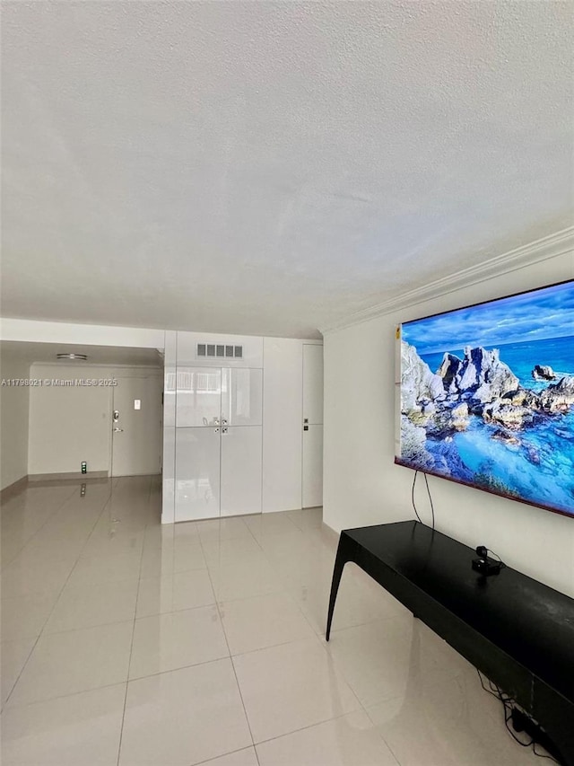 1200 W Ave Unit 209, Miami Beach, FL 33139 - living area featuring a textured ceiling and light tile patterned floors