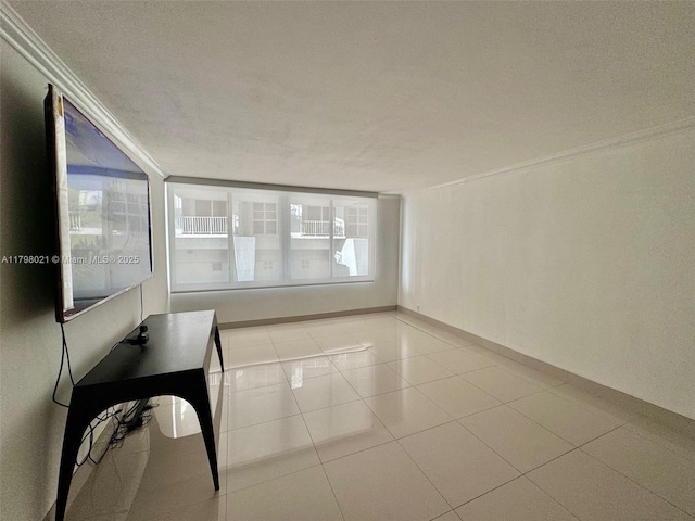 1200 W Ave Unit 209, Miami Beach, FL 33139 - empty room featuring ornamental molding and light tile patterned floors