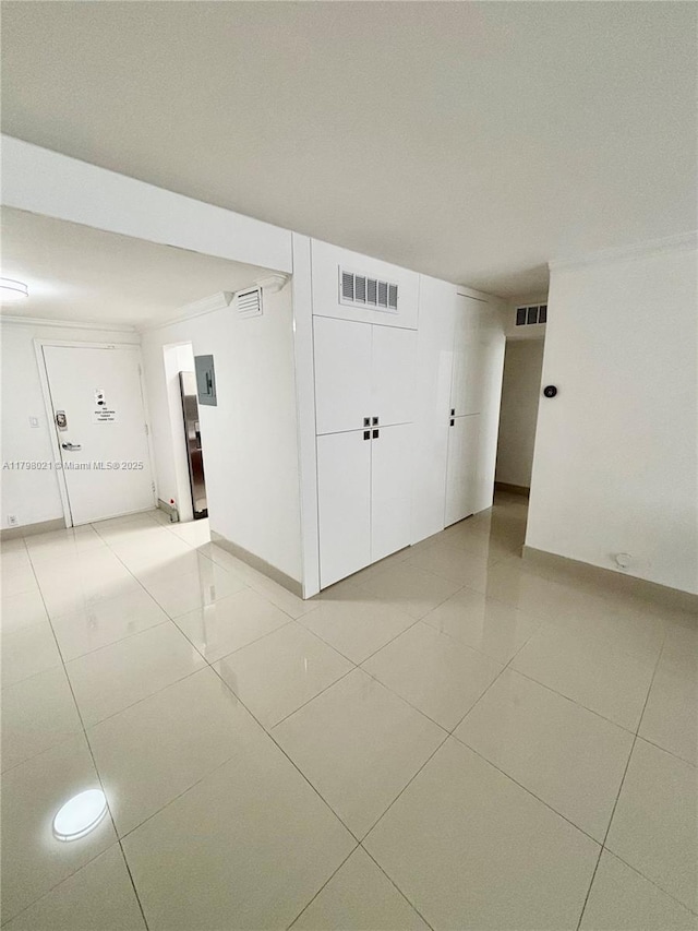 1200 W Ave Unit 209, Miami Beach, FL 33139 - spare room with light tile patterned floors and baseboards