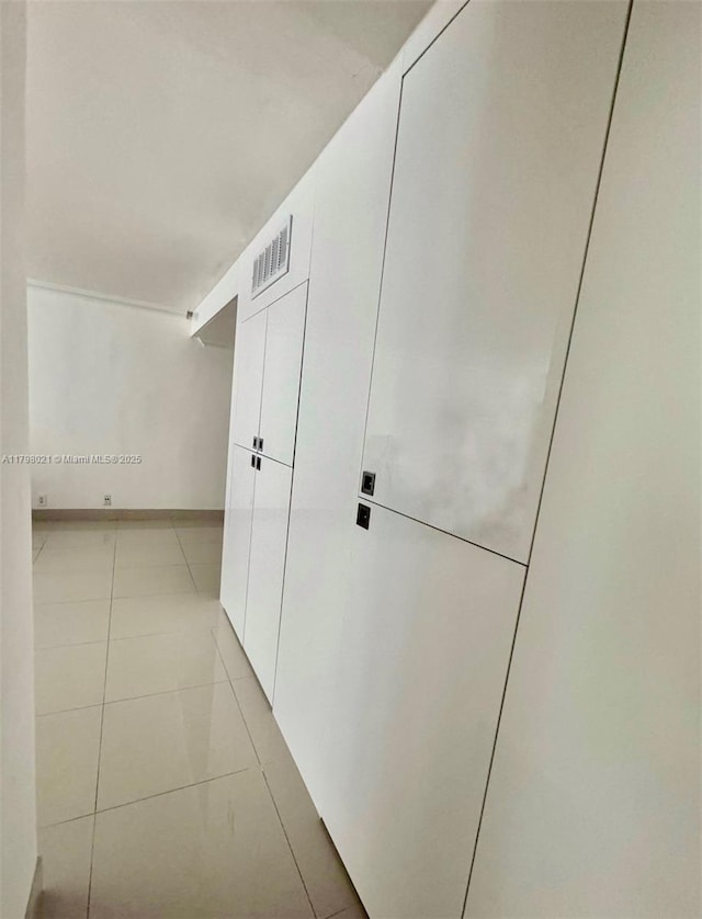 1200 W Ave Unit 209, Miami Beach, FL 33139 - hallway with light tile patterned floors