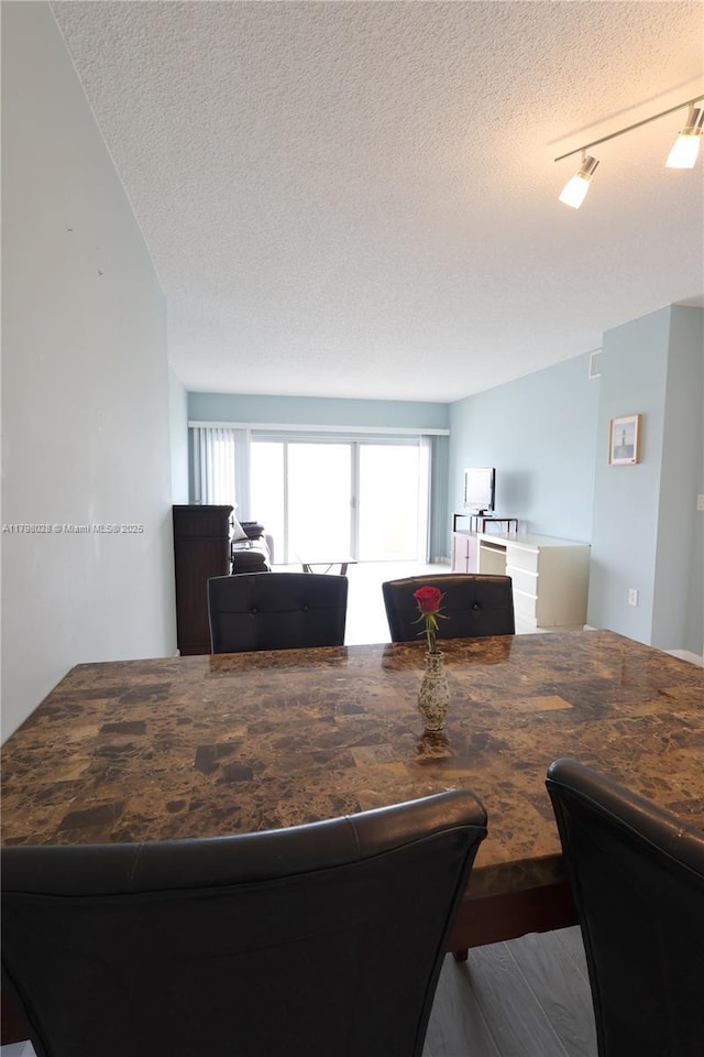 1985 S Ocean Dr Unit 21D, Hallandale Beach, FL 33009 - living area featuring a textured ceiling and wood finished floors