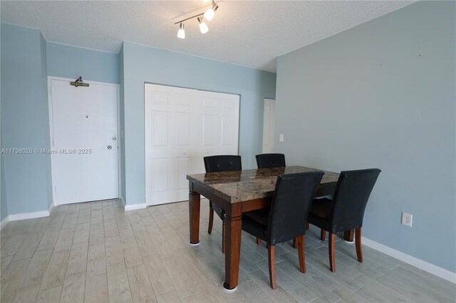 1985 S Ocean Dr Unit 21D, Hallandale Beach, FL 33009 - dining area featuring light wood-style flooring and a textured ceiling