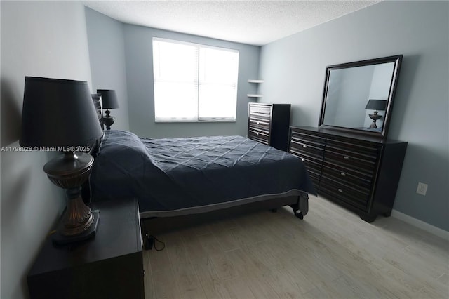 1985 S Ocean Dr Unit 21D, Hallandale Beach, FL 33009 - bedroom with light wood-type flooring and a textured ceiling