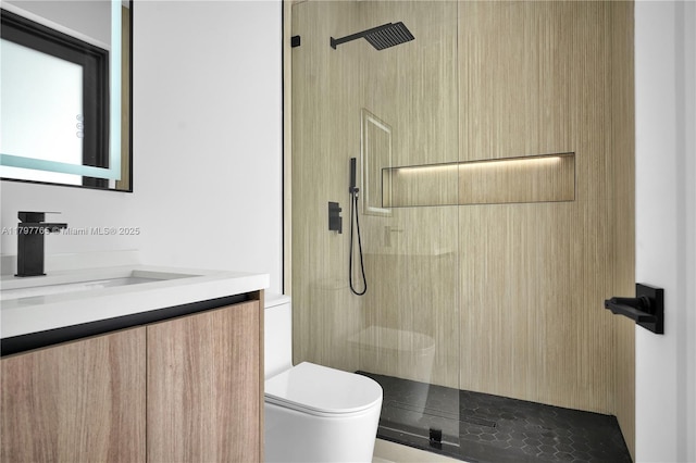 bathroom with toilet, vanity, and a walk in shower