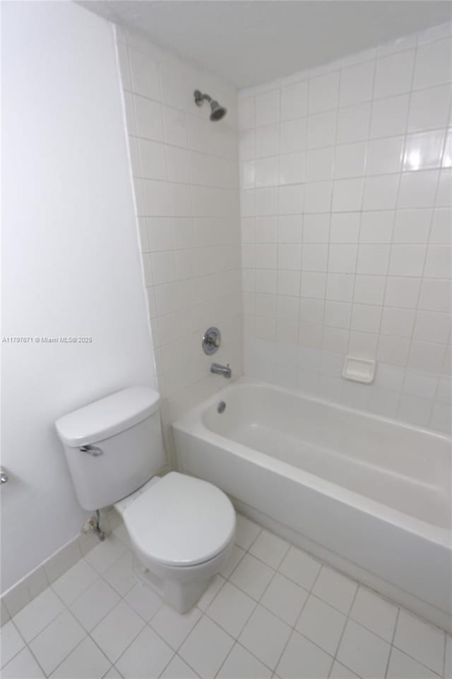 full bath with toilet, bathtub / shower combination, and tile patterned floors