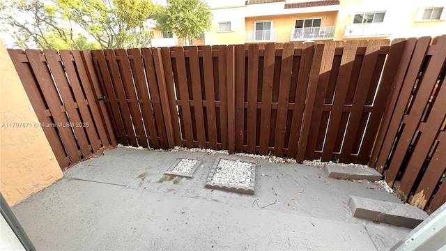 view of gate featuring fence