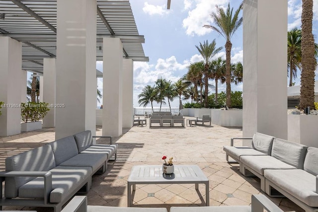 view of patio featuring an outdoor living space and a pergola