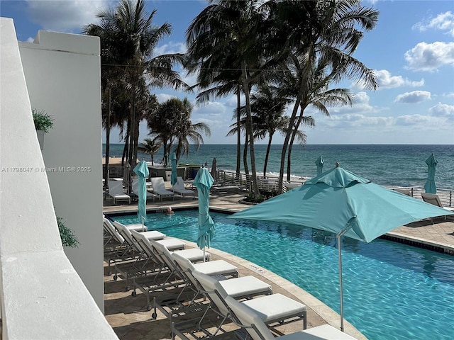 community pool featuring a water view