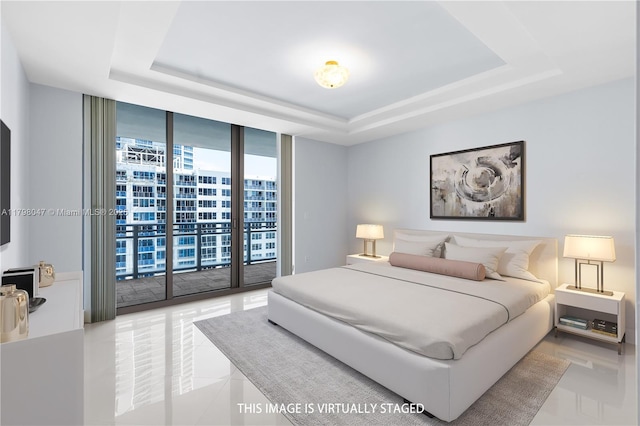bedroom with expansive windows, a raised ceiling, access to outside, and light tile patterned floors