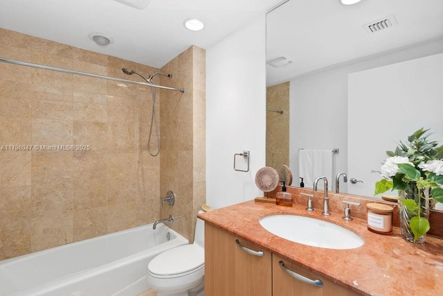 full bath featuring vanity, toilet, visible vents, and shower / tub combination