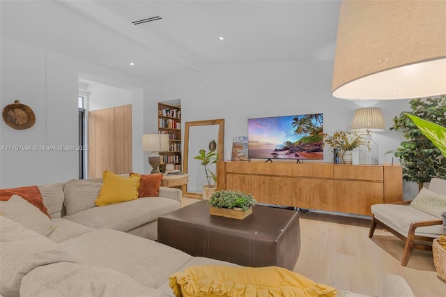 7560 SW 144th St, Palmetto Bay, FL 33158 - living room with visible vents, wood finished floors, beamed ceiling, and built in features
