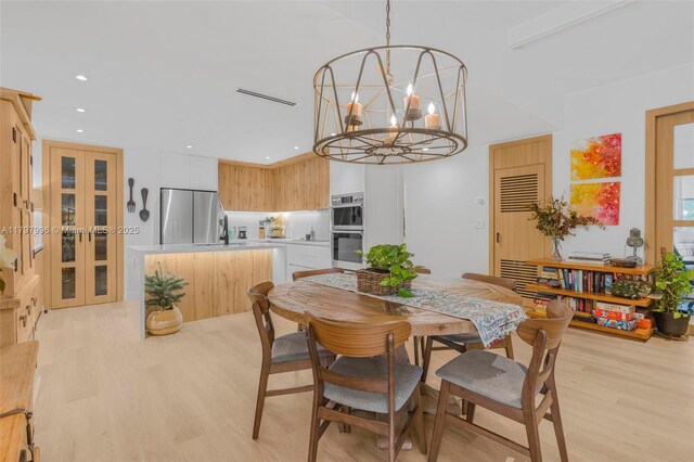 7560 SW 144th St, Palmetto Bay, FL 33158 - dining room featuring an inviting chandelier, light wood-style flooring, recessed lighting, and visible vents