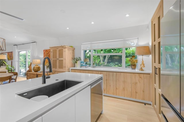 7560 SW 144th St, Palmetto Bay, FL 33158 - kitchen featuring light countertops, appliances with stainless steel finishes, modern cabinets, and a sink