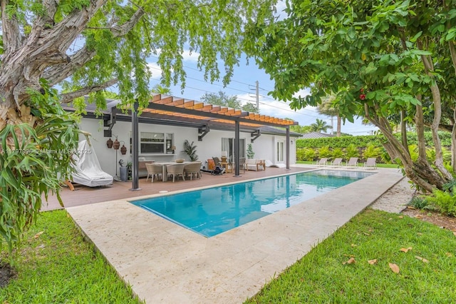 7560 SW 144th St, Palmetto Bay, FL 33158 - rear view of house with outdoor dining space, an outdoor pool, stucco siding, a pergola, and a tile roof
