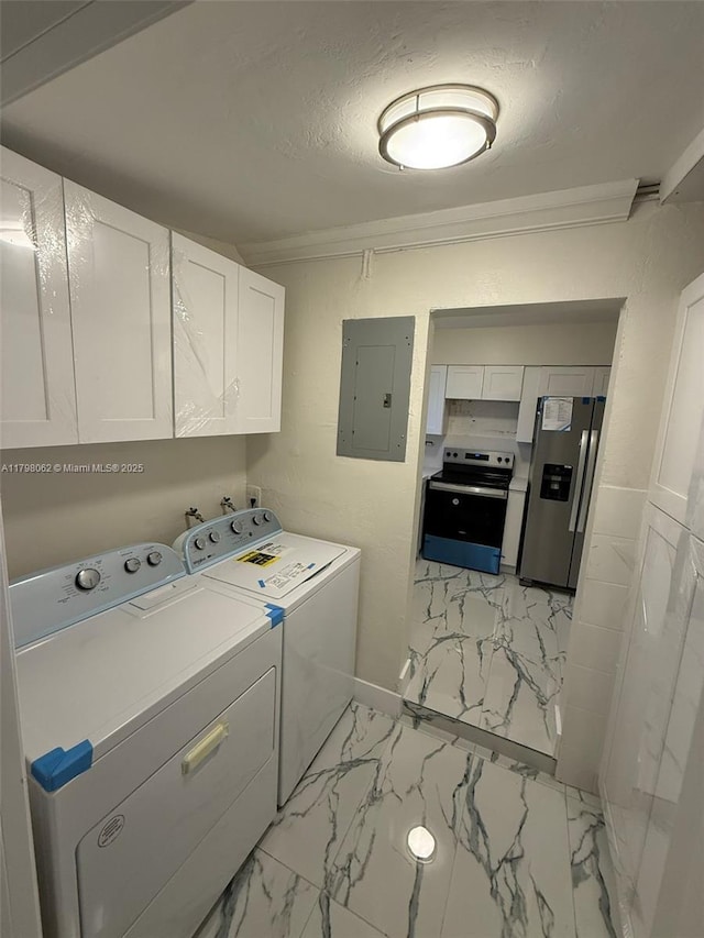 clothes washing area with marble finish floor, washing machine and dryer, cabinet space, and electric panel