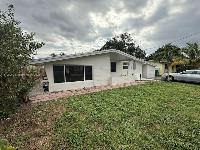 7410 Granada Blvd, Miramar, FL 33023 - exterior space with a yard and fence